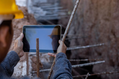 Man photographing with mobile phone