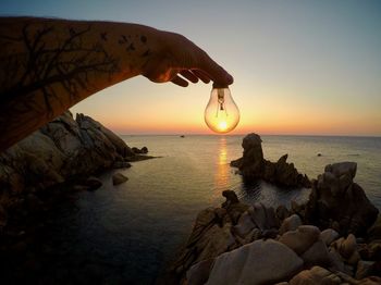 Scenic view of sea against sky during sunset