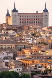 Alcazar and cityscape against sky