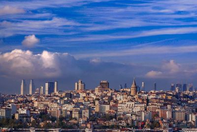 Modern buildings in city against sky