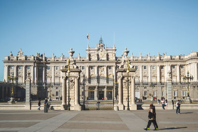 Group of people in front of historical building