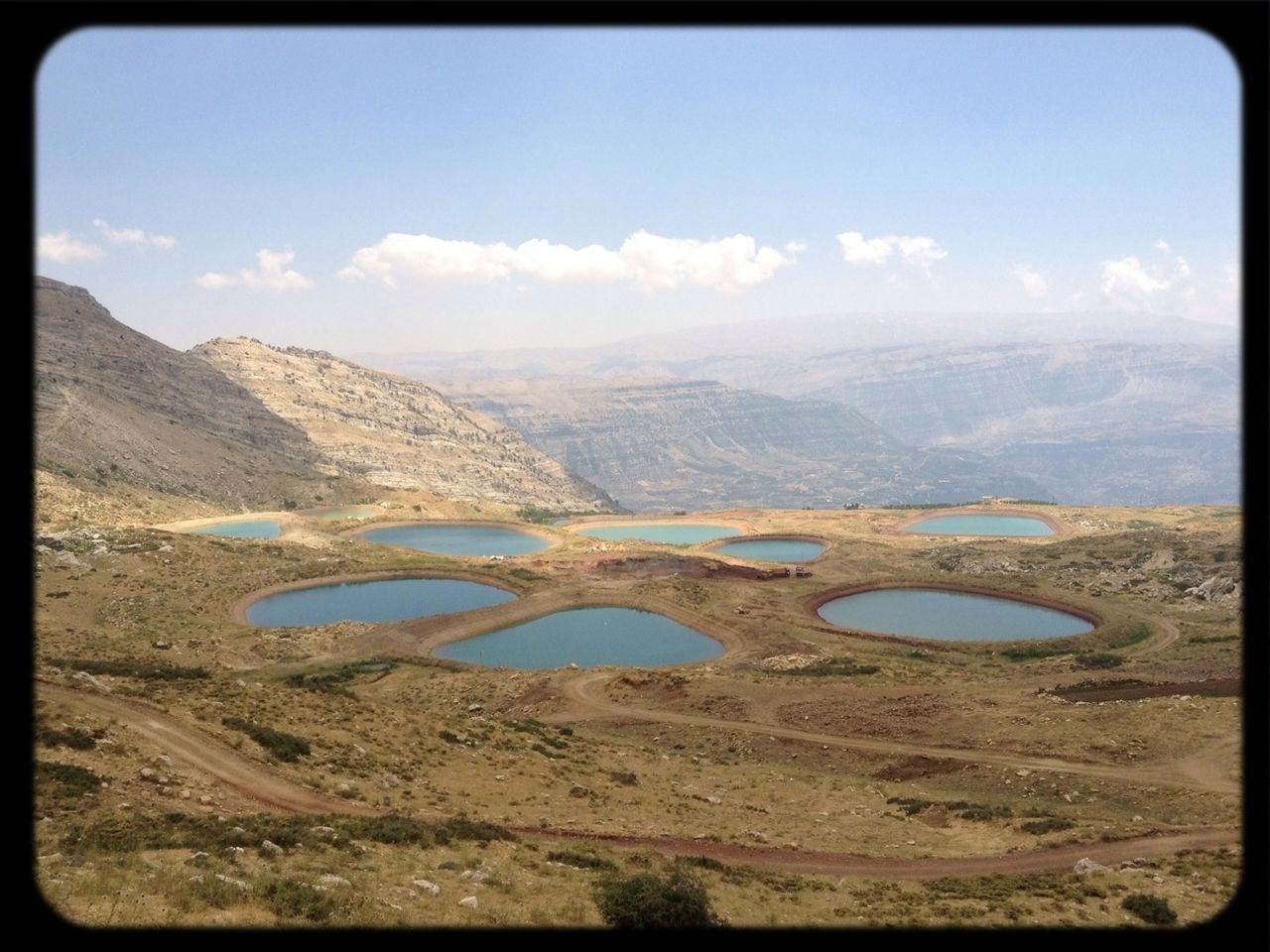 transfer print, mountain, landscape, sky, mountain range, auto post production filter, tranquil scene, tranquility, scenics, nature, beauty in nature, non-urban scene, cloud - sky, cloud, day, field, remote, no people, outdoors, horizon over land