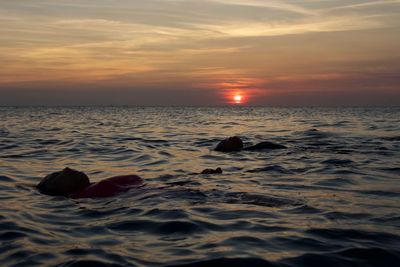 Scenic view of sea against sky during sunset