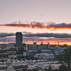 High angle view of buildings in city against sky during sunset