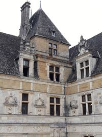 Low angle view of old building against sky