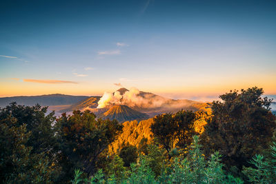 Scenic view of mountains against sky during sunset