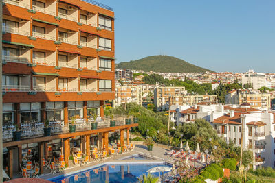 Buildings in city against clear sky