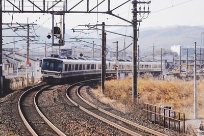 Train on railroad track against sky