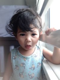 Portrait of cute baby girl at home