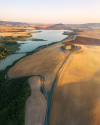 High angle view of land against sky during sunset