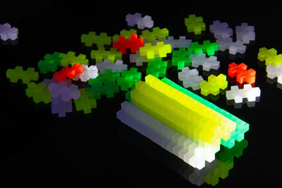 Close-up of colorful flowers on black background