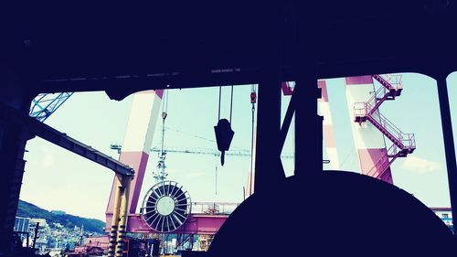 Low angle view of silhouette people against sky