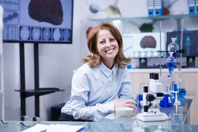 Portrait of female doctor working in laboratory