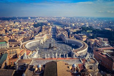 Aerial view of st peters square amidst buildings against sky in city