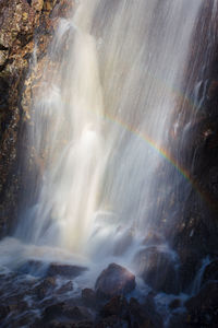 Double rainbow in waterfall spray in the hepoköngäs nature reserve in northern finland