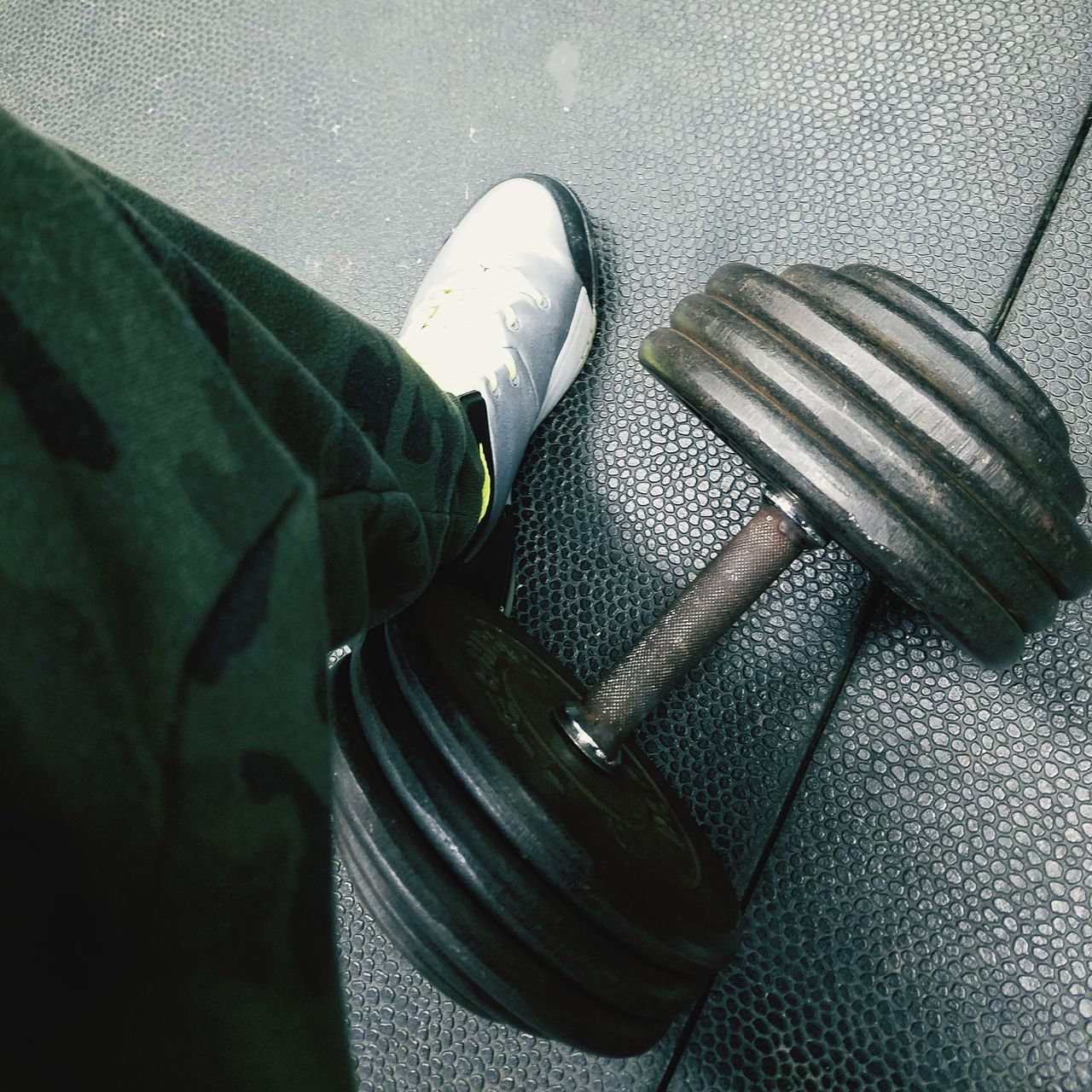 HIGH ANGLE VIEW OF MAN WEARING SHOES ON FLOOR