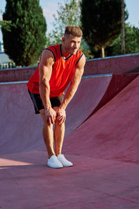 Side view of man exercising on road
