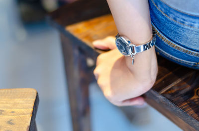 Close-up of woman hand on table