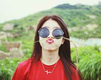 Portrait of young woman wearing sunglasses