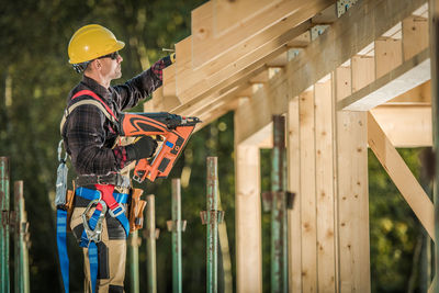 Side view of construction worker working
