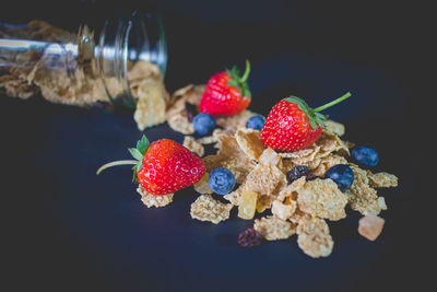 Close-up of strawberries in glass on table