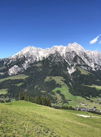 Scenic view of snowcapped mountains against sky