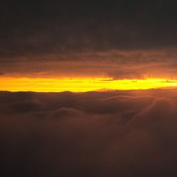 Scenic view of landscape against cloudy sky