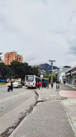 Street amidst buildings in city against sky