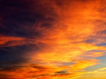 Low angle view of dramatic sky at sunset