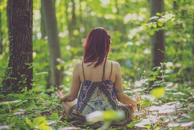 Rear view of woman in forest