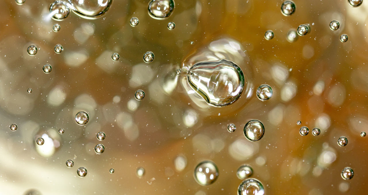 FULL FRAME SHOT OF WET GLASS WITH WATER