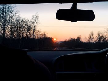 Cropped image of car on road