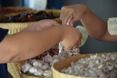 Midsection of man preparing food