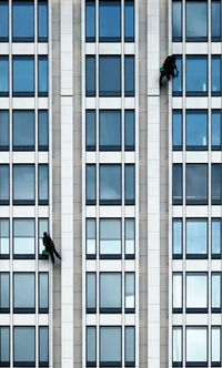 Low angle view of window washers