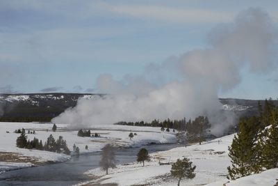 Panoramic view of snowcapped mountains against sky