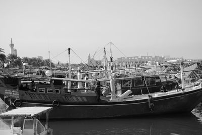 Boats moored at harbor