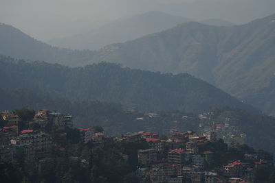 High angle view of townscape against mountains