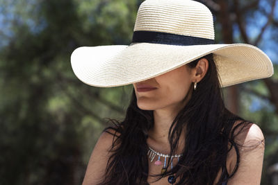 Portrait of beautiful woman wearing hat