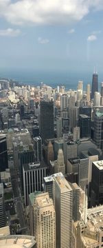 High angle view of buildings in city against sky