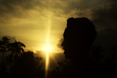 Portrait of silhouette man against orange sky