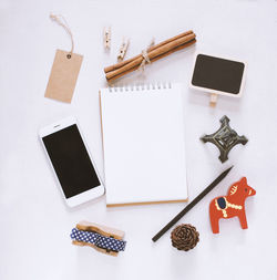 High angle view of pencil on table against white background