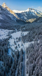 Scenic view of snow covered mountains against sky