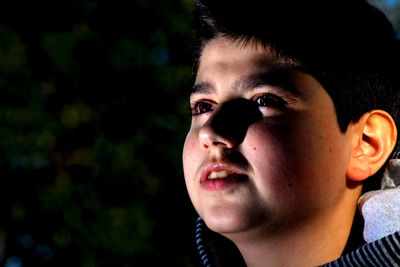 Close-up of boy looking away