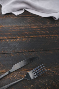 Decorated cutlery, fork and knife on a blue napkin. mockup