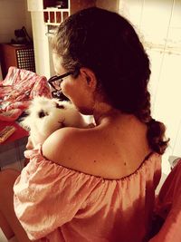 Woman with cat at home