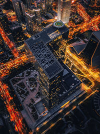 High angle view of illuminated buildings in city at night