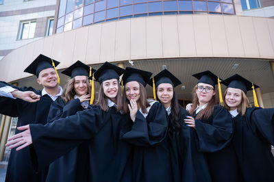 Portrait of woman wearing graduation gown