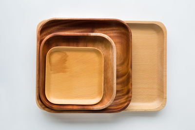 Directly above shot of objects on table against white background