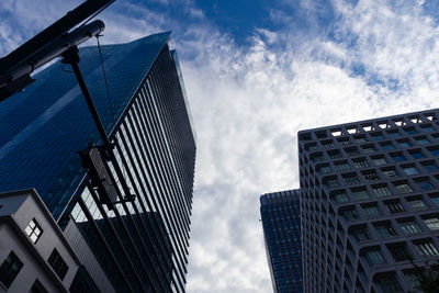 Low angle view of modern buildings against sky