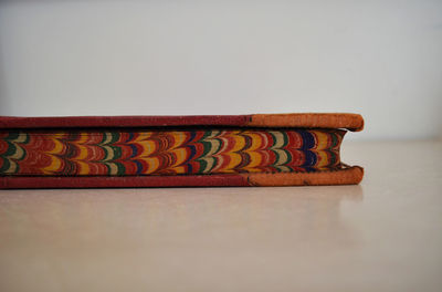 Close-up of hardcover book against white background